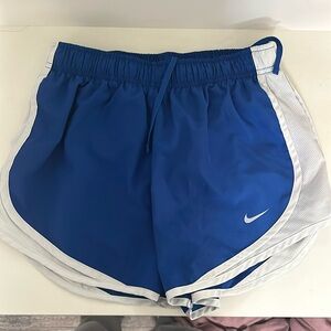 Blue and white Nike running shorts